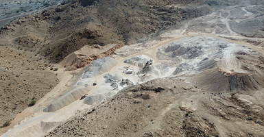 Mining site with trucks and machinery
